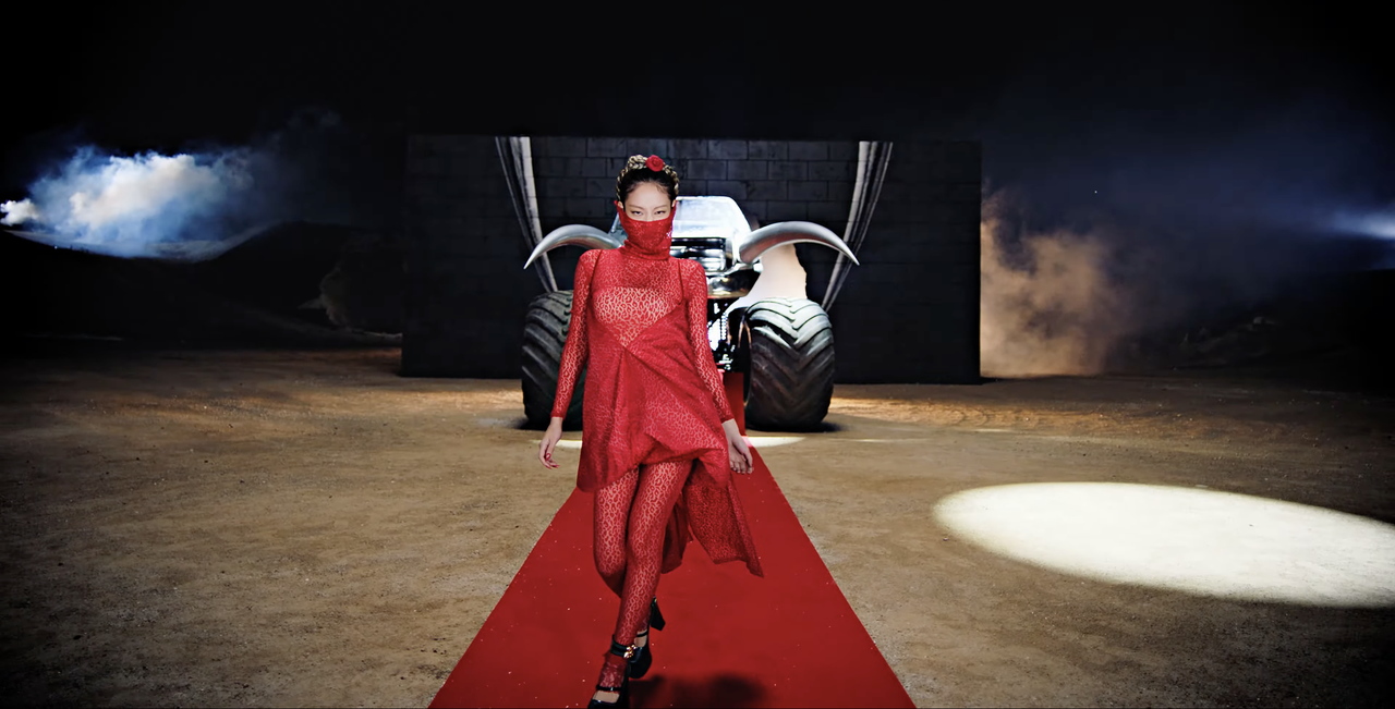 Jennie wears an Alaïa gown, GCDS heels, and Chanel jewelry.